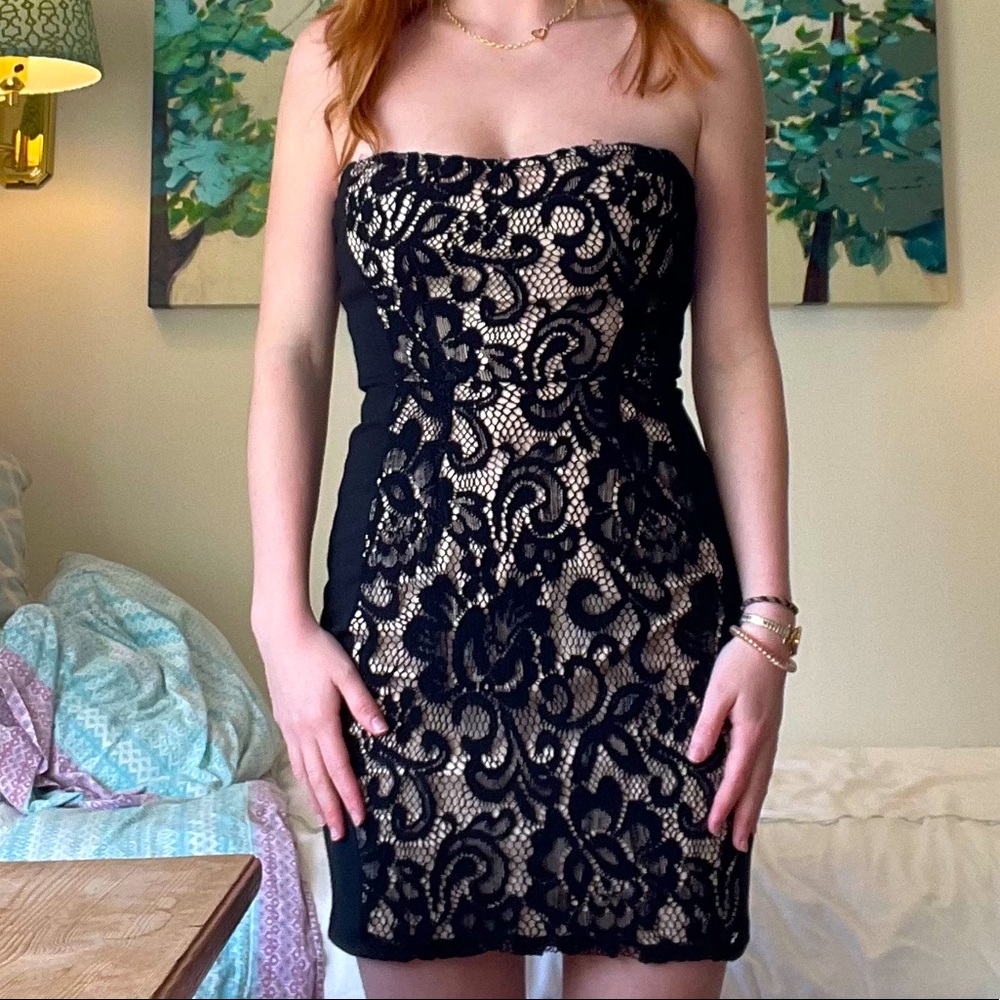 Black body con with lace detailing down the middle